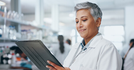 Wall Mural - mature woman, science and tablet in laboratory for discovery, innovation or pharmaceutical research.