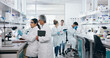 © peopleimages.com - Experiment, science and group of people in laboratory for work on breakthrough, cure or development. Innovation, investigation and research with scientist team in clinical trial for medicine