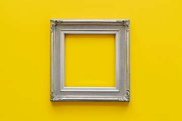 Wall Mural - Minimalist silver frame on yellow background, top view, flat lay, high resolution, copy space concept


