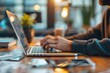 © Iftikhar alam - A person typing on a laptop computer placed on a table, An innovative new software platform for optimizing small business operations