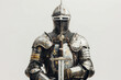 © Artemiy - Medieval knight with armor and sword on a white backdrop