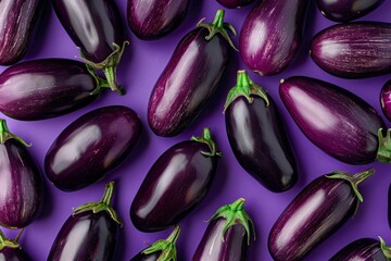 Sticker - Top view of ripe aubergines neatly arranged on a vibrant purple surface