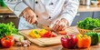 © Sujid - Close up shot of a chef's hands chopping colorful vegetables on a cutting board, chef, hands, chopping