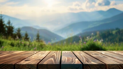 Wall Mural - Wooden table top with blurred mountain and grass background depicting a fresh and relaxing concept for product display or design visual with ample space for copy