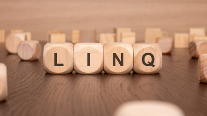 Poster - four wooden cubes with the text 'LING' on a brown background