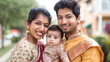 © Graphic Master - Happy modern indian couple with baby