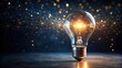 © Sujid - A sparkling light bulb shining brightly in the darkness, sparkle, glowing, illumination, darkness, contrast