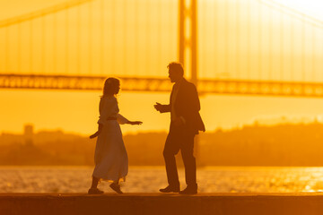 Wall Mural - Couple Dancing at Sunset - man and woman