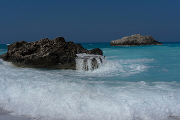 Wall Mural - waves breaking on rocks