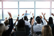© AK Coop/peopleimages.com - Presentation, conference and leader with question from audience for workshop, meeting and speech. Entrepreneurship, business training and men and women ask in seminar, hand raised or convention event
