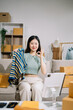 © Nuttapong punna - Fashion blogger concept, Young Asian women selling clothes on video streaming.Startup small business SME, using smartphone or tablet taking receive and checking.