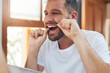 © Hira/peopleimages.com - Man, teeth and flossing with morning routine in home for grooming, oral care and hygiene for wellness. Male person, reflection and mouth for dental health, fresh breath and bathroom with confidence