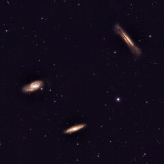 Wall Mural - deep space astrophotography using a telescope capturing the leo triplet of galaxies m66