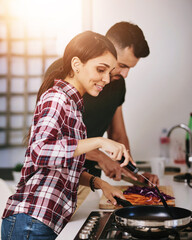 Canvas Print - Cooking, pan and stove with couple in kitchen of home together for diet, health or nutrition. Food, love or romance with man and woman at counter in apartment for meal preparation or wellness