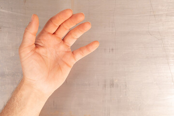 Poster - A hand reaches out against a textured background