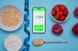 © Kamil - Calorie counting application on the screen of a modern smartphone. Taking care of your diet and eating healthy