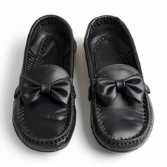 Wall Mural - Comfortable black leather moccasins with a bow detail, isolated on white background.