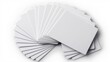 © konlawat - Multiple blank white credit cards arranged in a fan shape, casting subtle shadows on a pure white background, with sharp edges and glossy surfaces