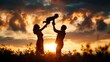 © Alice a. - A family of three, a man, a woman and a child, are silhouetted against a sunset. Scene is warm and loving