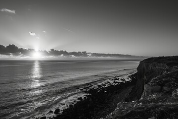 Wall Mural - a poignant black and white photo of a plastic-free coastline at sunrise