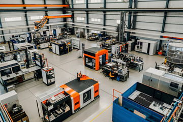 Poster - Aerial view of a modern factory with an automated production line operating at full capacity, showcasing advanced manufacturing technology