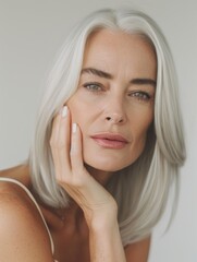 Wall Mural - Graceful woman with straight gray hair in white tank top