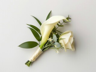 grooms boutonniere with a calla lily and greenery, isolated on a white background, showcasing the ar