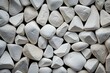 © juliars - Smooth white pebble texture background with close-up view of polished river stones, perfect for spa, garden, landscaping, and zen concept