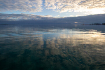 Wall Mural - Beautiful calm sea and cloud reflection in the water