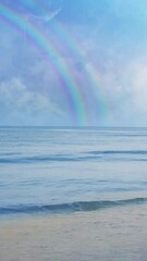 Wall Mural - vertical storm's end double rainbow promise 4k loop features ocean waves crashing onto the shore wit