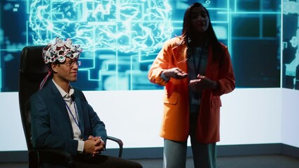Poster - Neuroscientist doing demonstration at AI convention gathering tech startups and academics, showing how to use EEG headset to link brain with artificial intelligence, camera A