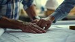 © Hanasta - Close-up of Hands Reviewing Blueprints
