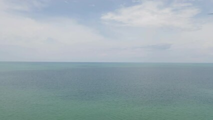 Wall Mural - Aerial view of clear blue turquoise seawater, Andaman sea in Phuket island in summer season, Thailand. Water in ocean pattern texture wallpaper background.