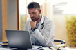 © Hira/peopleimages.com - Male person, medical doctor and laptop with thinking, ideas and planning in office as physician. Man, pediatrician and diagnosis, telehealth and technology for patient records, medicine or surgery