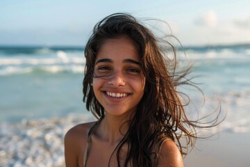 Wall Mural - Young girl on the beach