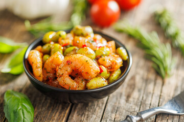 Wall Mural - Fresh salad with shrimps and edamame soybeans in bowl on wooden table.