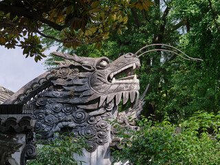 stone carved dragon in a garden