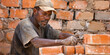 © WD Stock Photos - A bricklayer building a wall