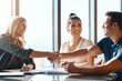 © ReeseArcurs/peopleimages.com - Trust, couple and financial advisor with handshake for deal, agreement or greeting in office. Welcome, meeting and woman broker with people shaking hands for contract, loan application or investment