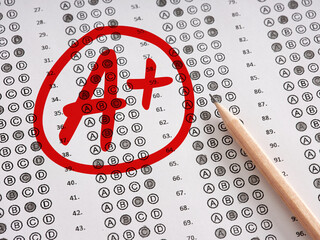 Wall Mural - Test exam grade A plus with a red circle on a sheet of paper with pencil.