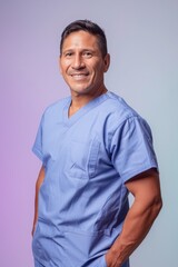 Wall Mural - Portrait of a smiling male medical professional in scrubs