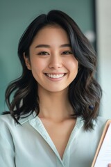 Wall Mural - Portrait of a young Asian woman smiling cheerfully