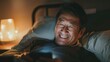 © Iuliia - a mature smiling chinese man lying in bed, looking at his cell phone