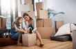 © ReeseArcurs/peopleimages.com - Mother, daughter and help with packing boxes for new home with moving, mortgage investment or property relocation. Woman, child and support with tape for cardboard package or real estate in apartment