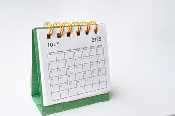 Wall Mural - July 2025 table calendar on white background with customizable space for text