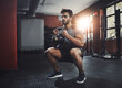 © peopleimages.com - Man, fitness and training with kettlebell in gym for muscle, wellness or healthy body. Energy, exercise and strong person weightlifting to squat for power, bodybuilding and workout at club for sport
