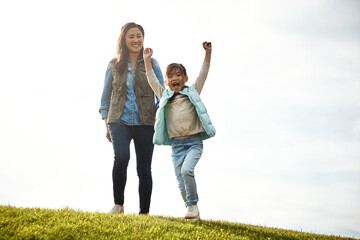 Wall Mural - Celebration, mom and girl in countryside for walk, vacation and park for outdoor outing. Love, bonding and support from mother or female person, child and adventure for family fun in autumn together