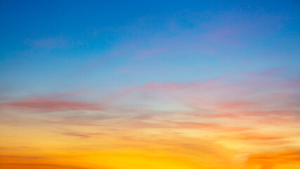 clouds and orange sky,real majestic sunrise sunset sky background with gentle colorful clouds withou
