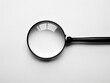 © Lita Clarus - A magnifying glass is shown on a white background