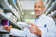 © StarDweller/peopleimages.com - Medicine, stock and medical worker in pharmacy for healthcare, wellness or service for retail. Man, inventory and pills or supplements in hospital for inspection, information and check label